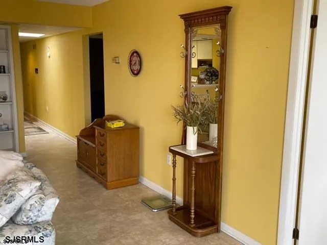 a view of hallway with mirror