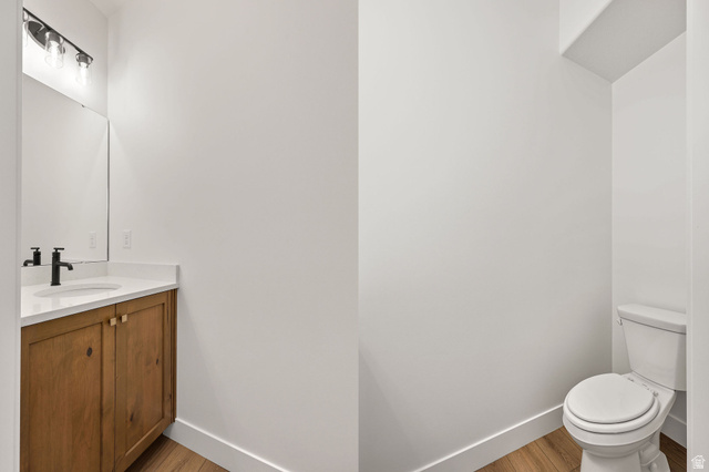 1661 West Ross Road Syracuse, UT 84075 - Photo 13 of 28 Bathroom featuring vanity and light wood-type flooring