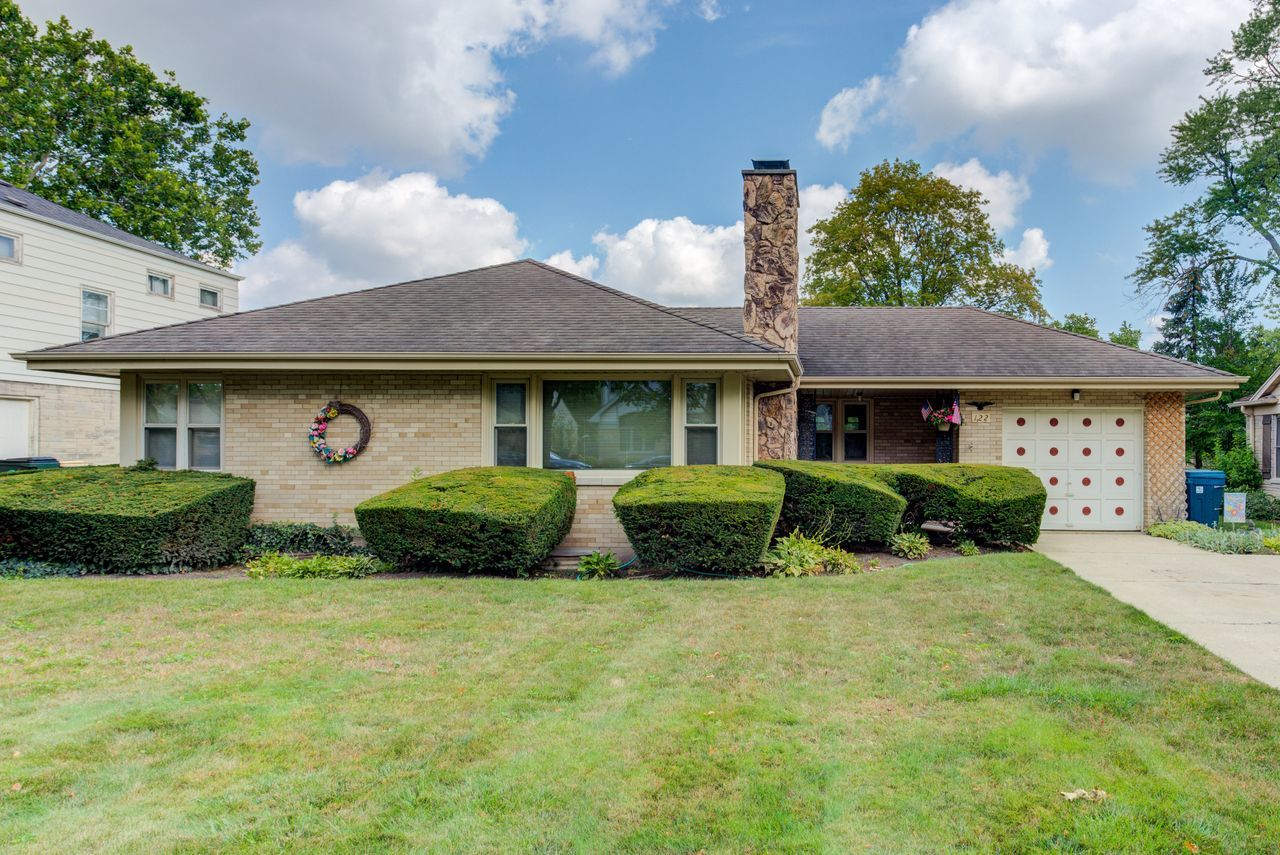 122 Wilma Place Park Ridge, IL 60068 - Photo 1 of 20 a front view of a house with a yard