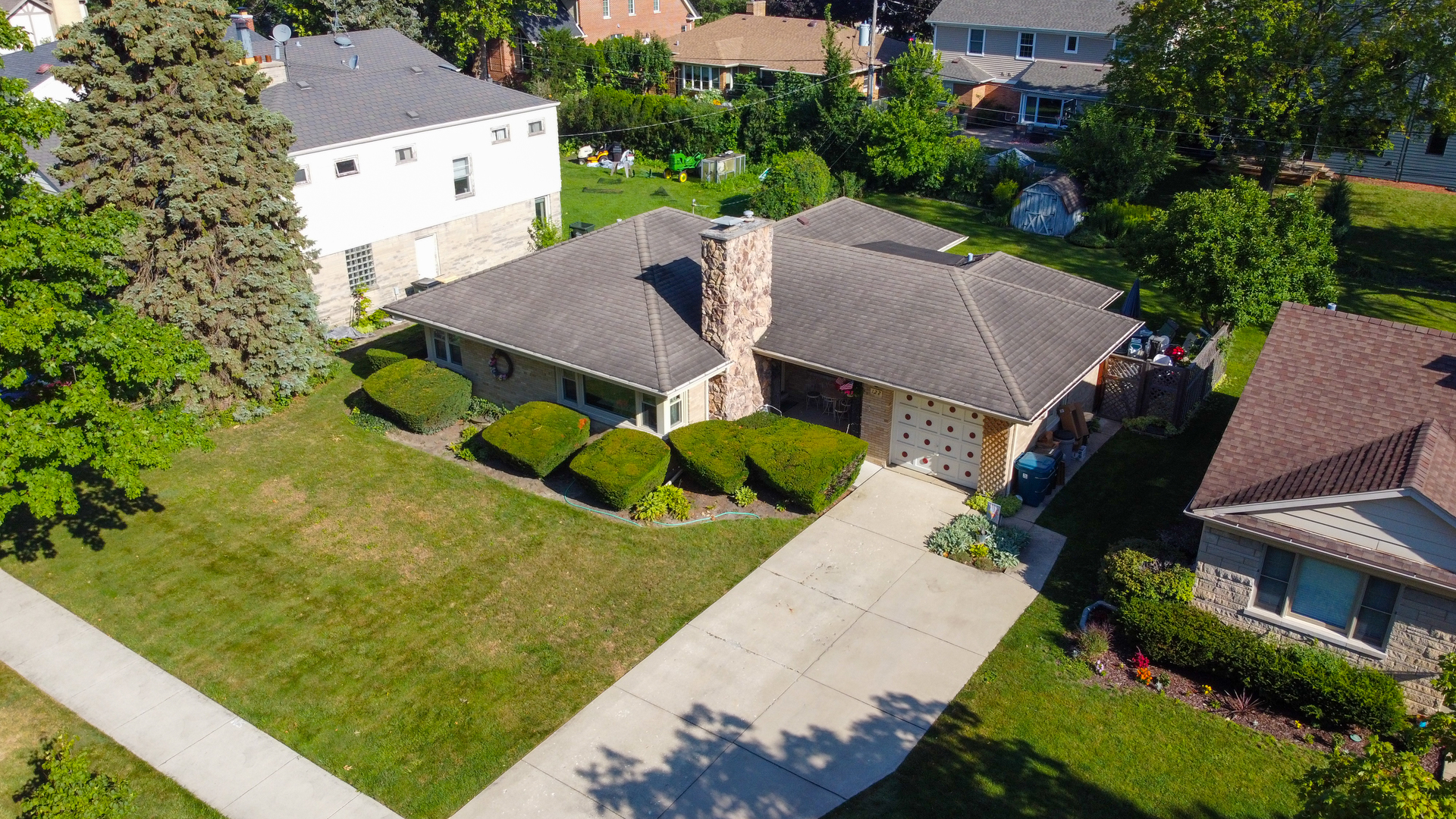 122 Wilma Place Park Ridge, IL 60068 - Photo 2 of 20 an aerial view of a house with swimming pool and large trees