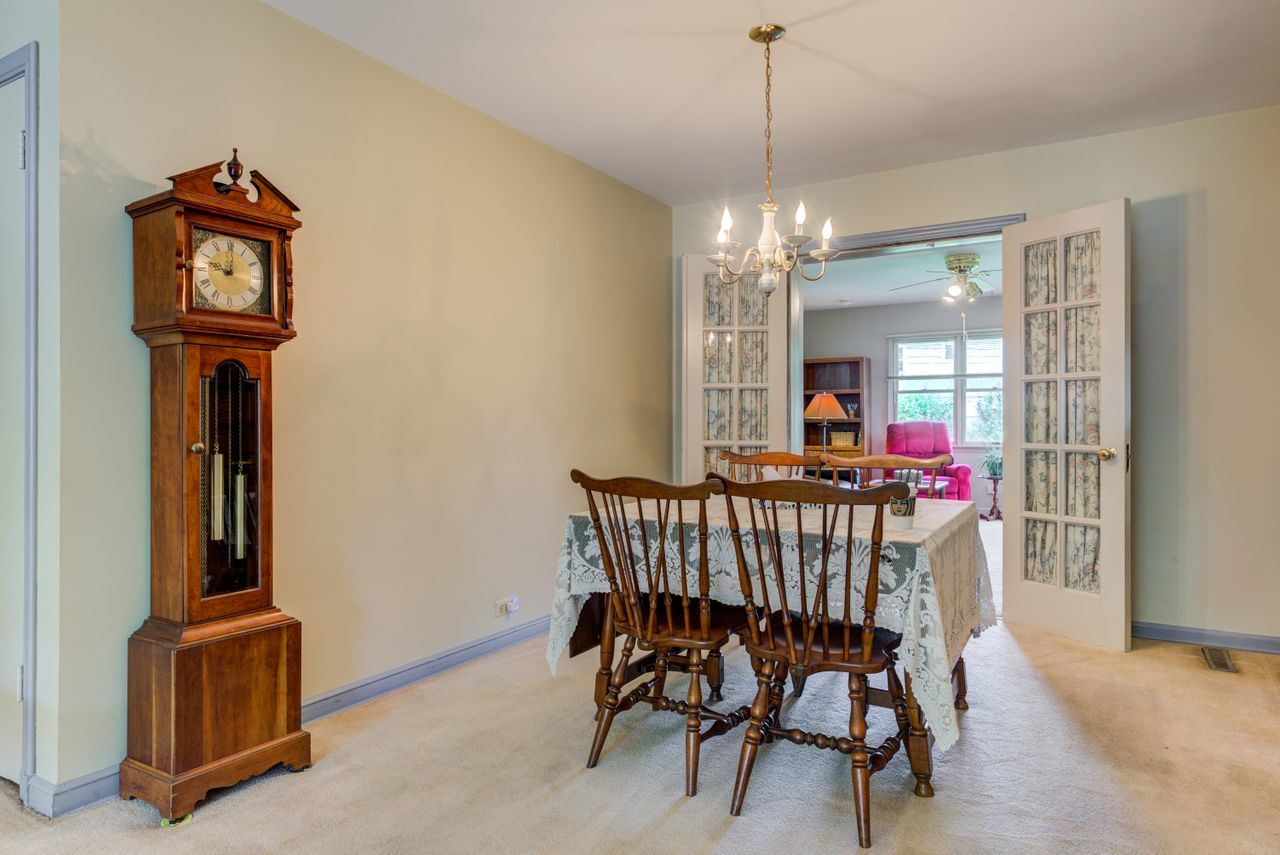 122 Wilma Place Park Ridge, IL 60068 - Photo 7 of 20 a view of a room with furniture a chandelier and wooden floor