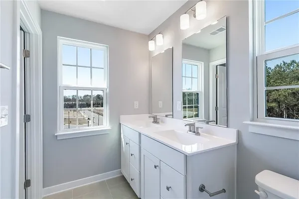 a bathroom with a sink and a window