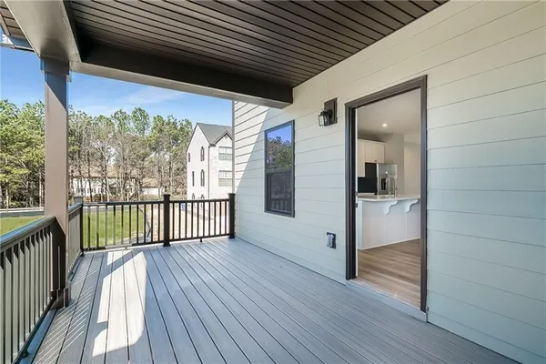 a view of a porch with wooden floor and stairs