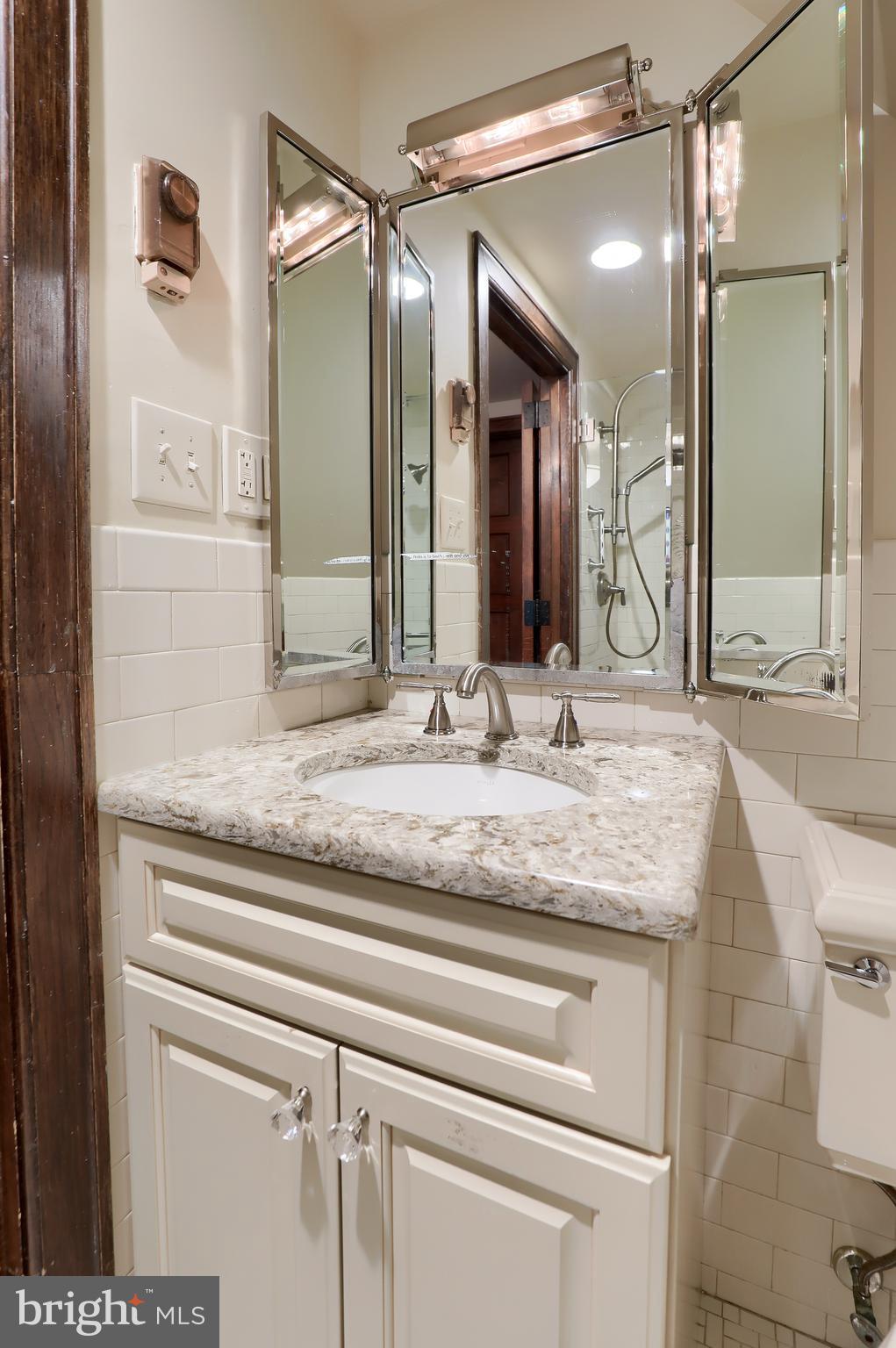 80 School House Road Lancaster, PA 17603 - Photo 45 of 87 a bathroom with a granite countertop sink and a mirror
