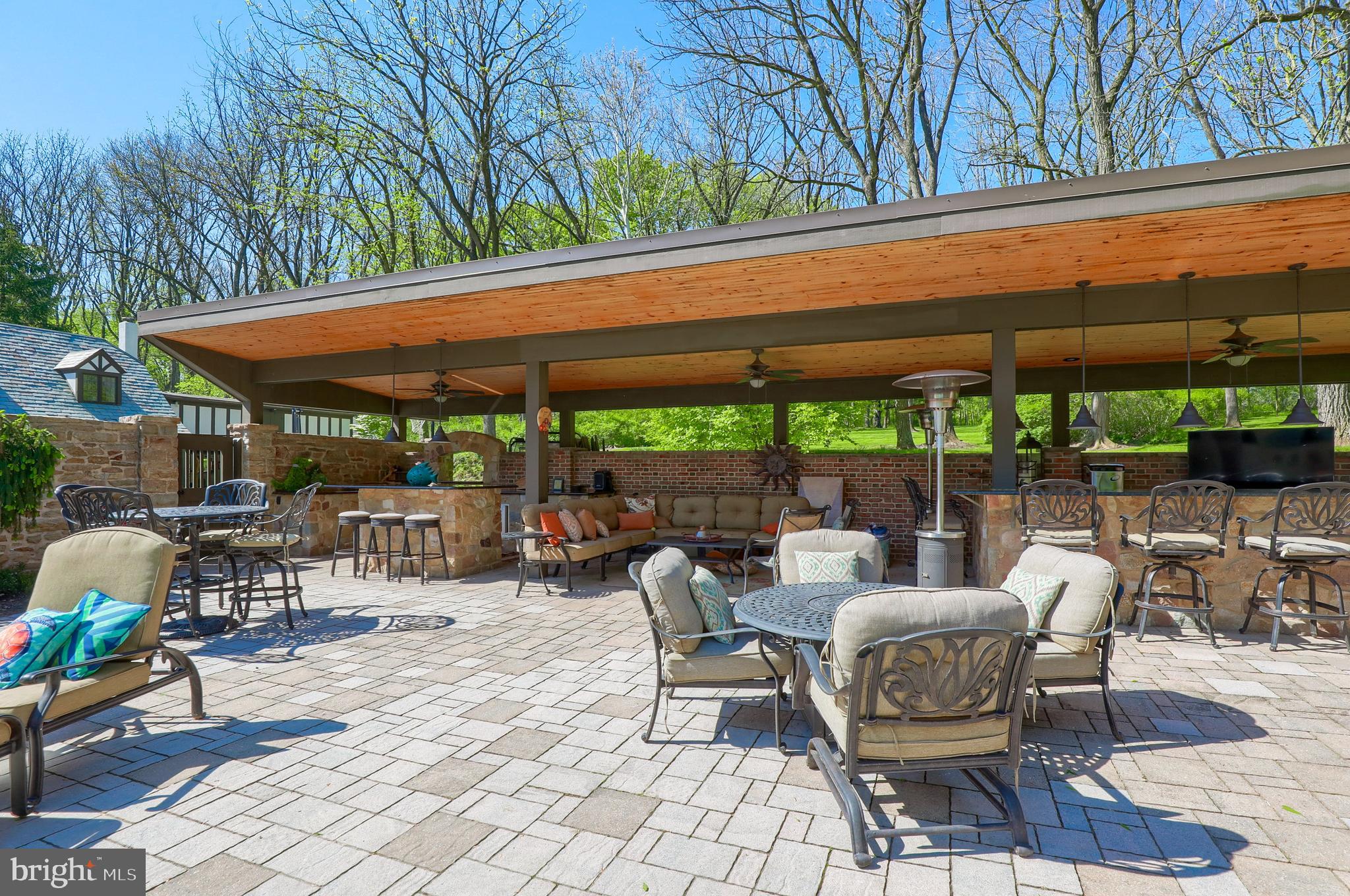 80 School House Road Lancaster, PA 17603 - Photo 5 of 87 a patio with a table and chairs under an umbrella