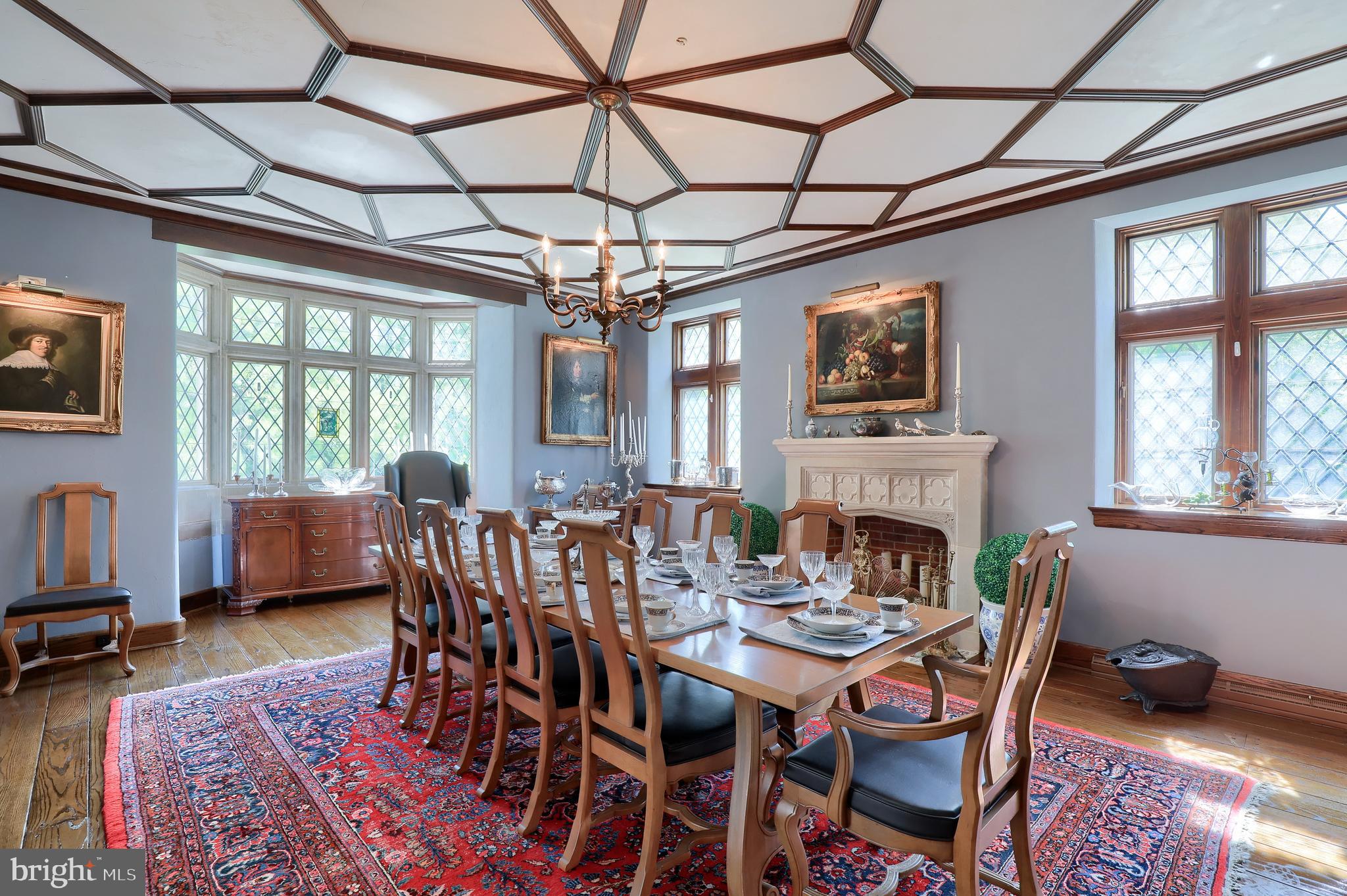 80 School House Road Lancaster, PA 17603 - Photo 7 of 87 a dining room with furniture a flat screen tv and a fireplace
