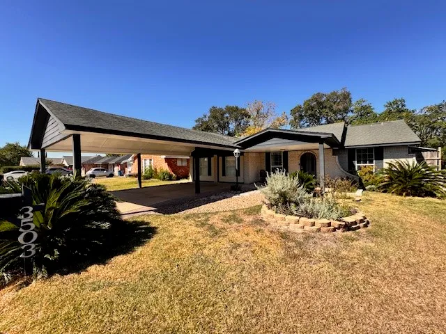 a front view of a house with yard porch and seating