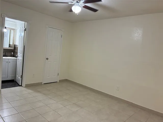 a bathroom with a double vanity sink toilet and shower