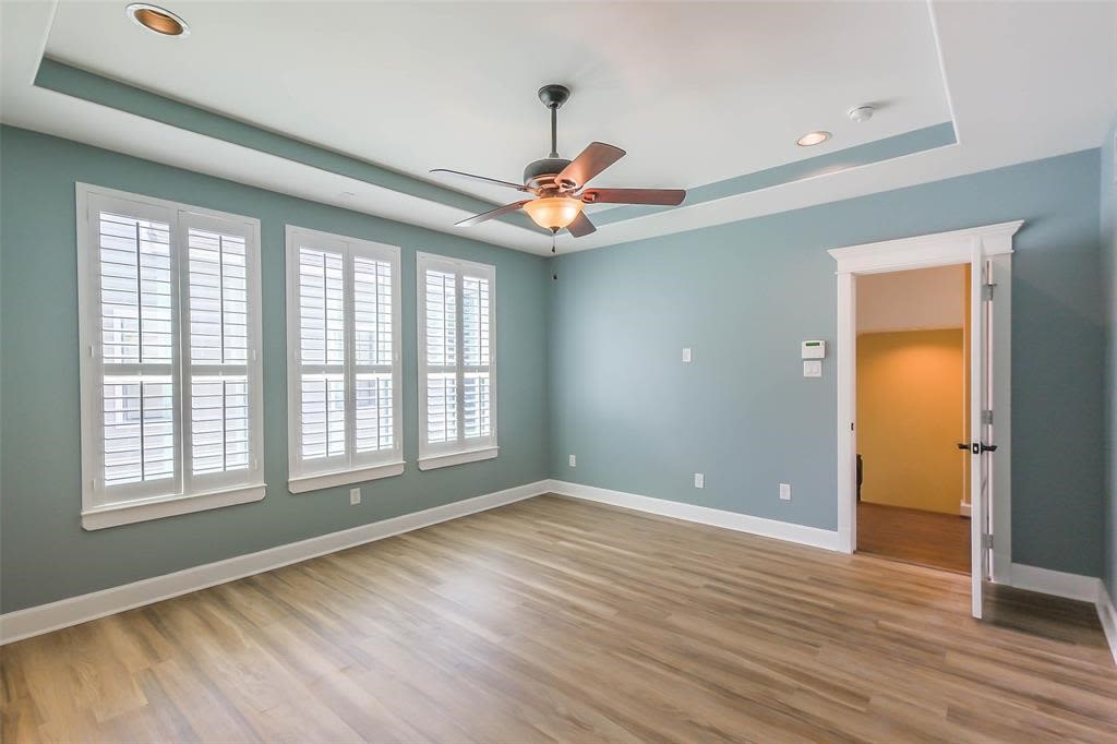 706 Allston Street, Unit B Houston, TX 77007 - Photo 14 of 33 a view of an empty room with window and wooden floor
