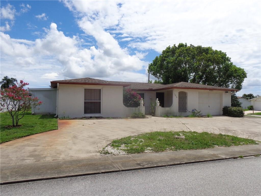 7814 Red Run Drive Port Richey, FL 34668 - Photo 1 of 1 Circular drive provides extra parking.