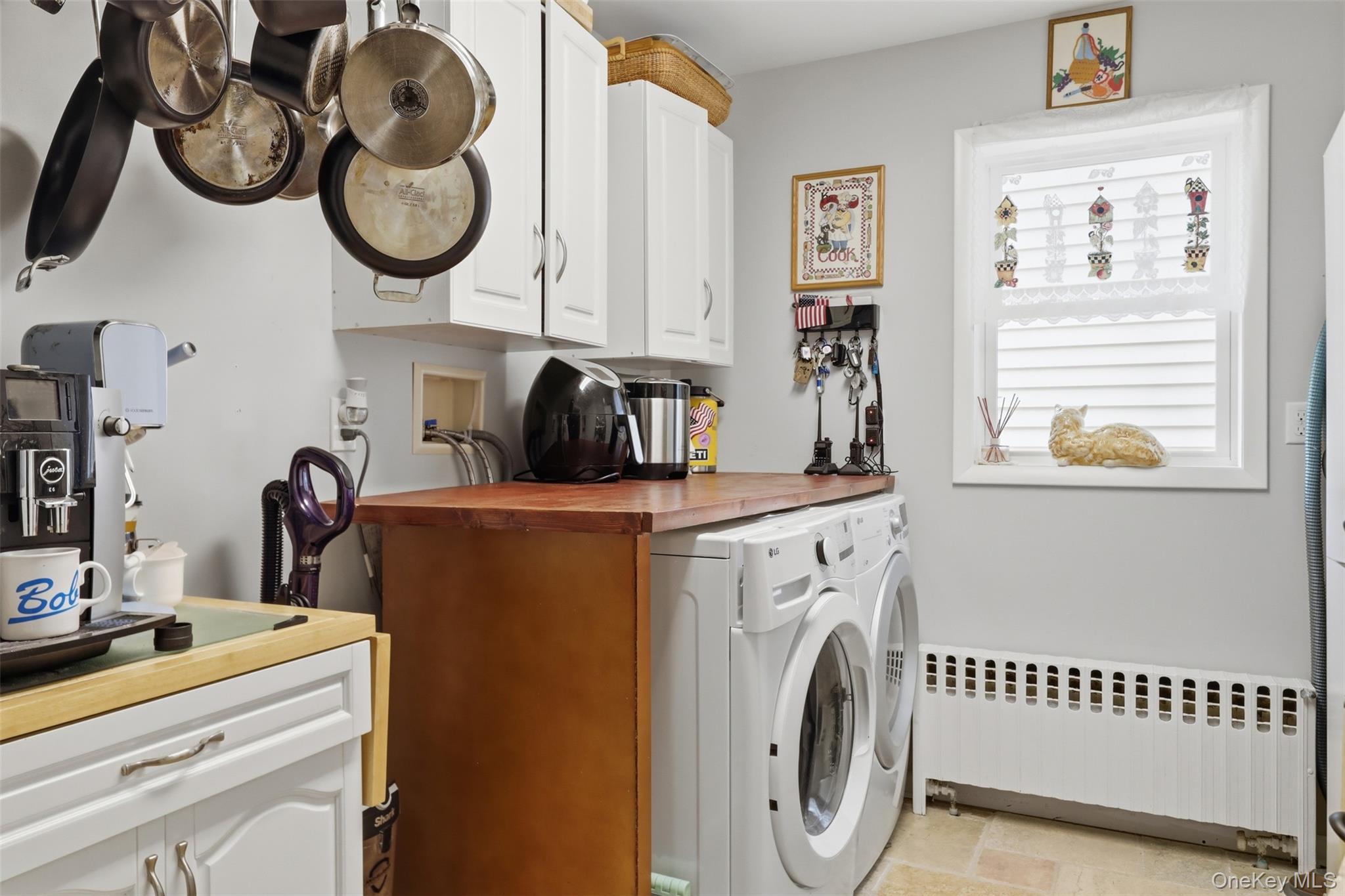 1 Hiko Place Fishkill, NY 12524 - Photo 25 of 41 Functional laundry area with front-loading washer and dryer units, complemented by a wood-finish countertop