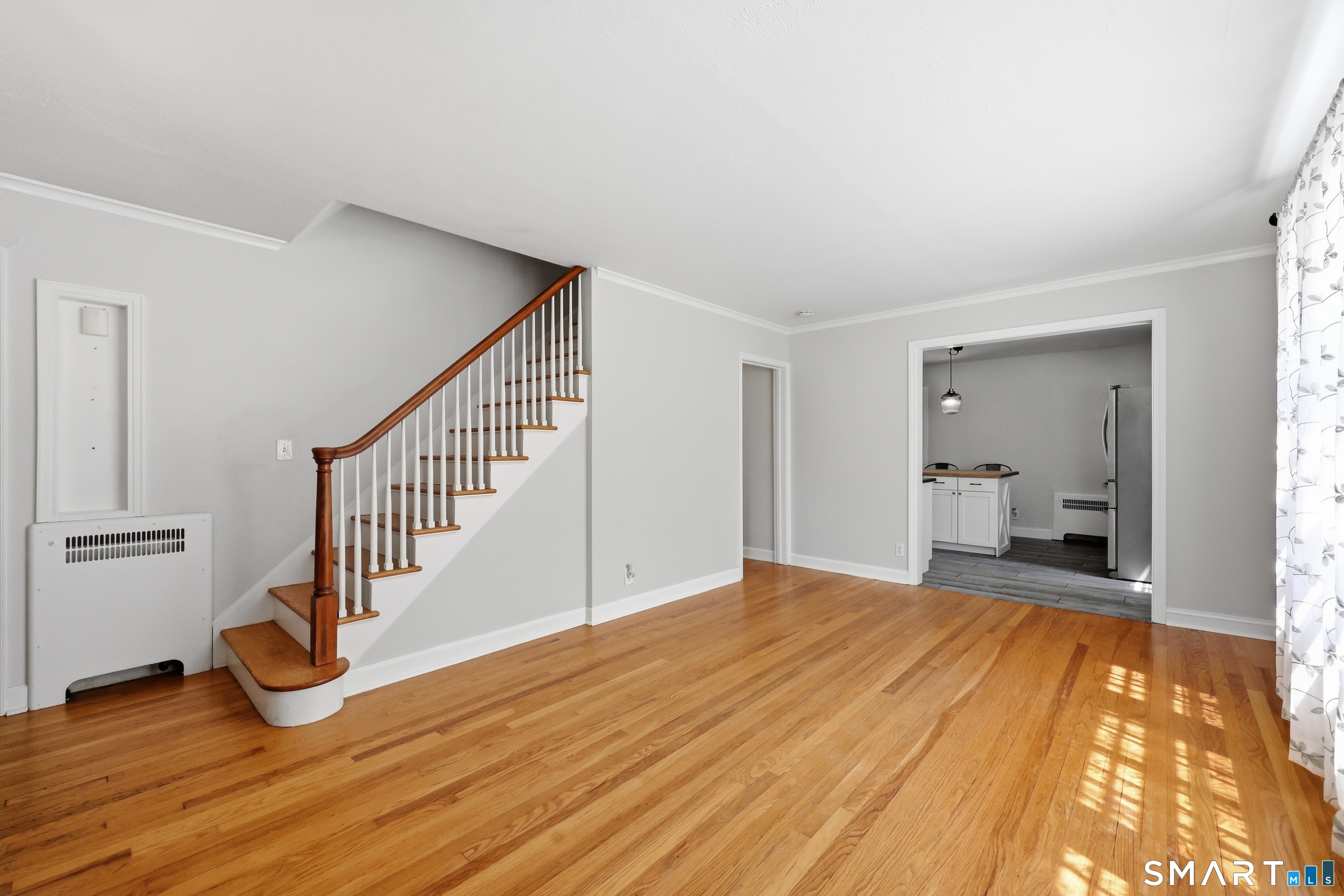 122 Overbrook Road West Hartford, CT 06107 - Photo 2 of 23 Hardwood floors and an easy flow from the living room into the kitchen.