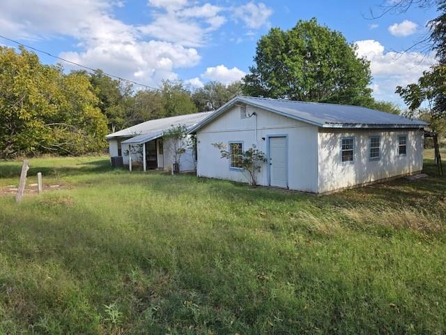 300 A E 3rd Street Iredell, TX 76649 - Photo 4 of 11 a view of a house with a yard and fence