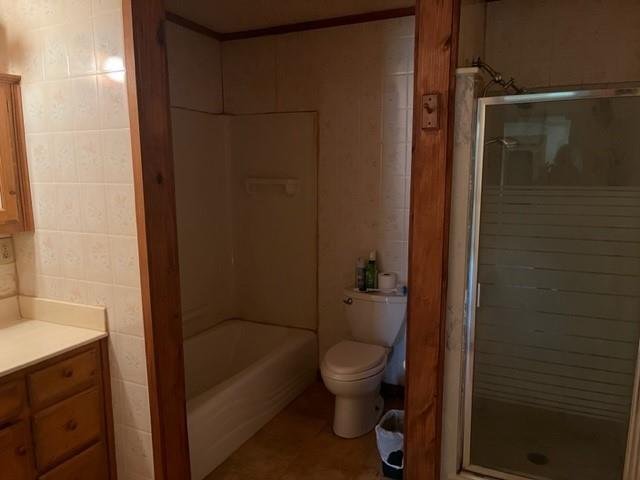 300 A E 3rd Street Iredell, TX 76649 - Photo 7 of 11 a bathroom with a shower and a toilet