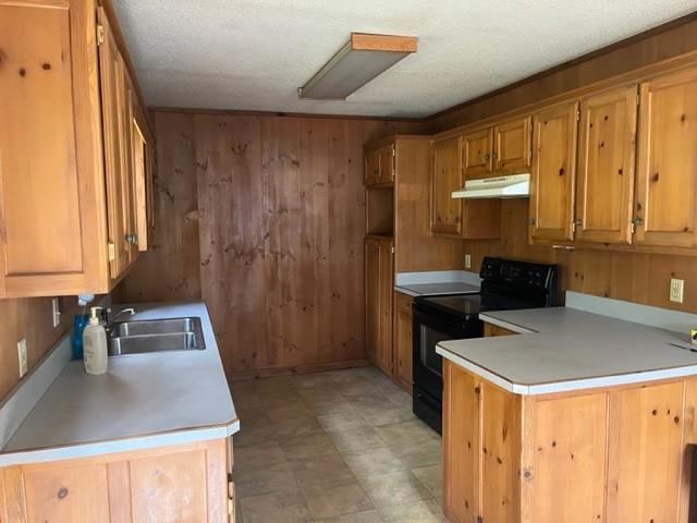 300 A E 3rd Street Iredell, TX 76649 - Photo 9 of 11 a kitchen with a sink and a stove top oven