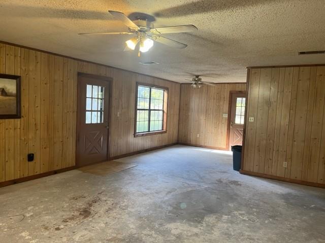 300 A E 3rd Street Iredell, TX 76649 - Photo 10 of 11 an empty room with windows and fan