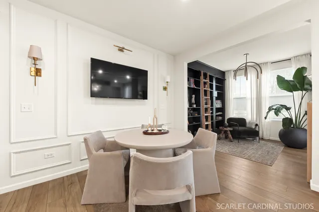 a dining room with furniture and window