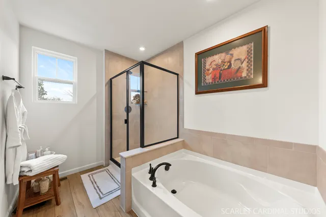 a bathroom with a bathtub and a window