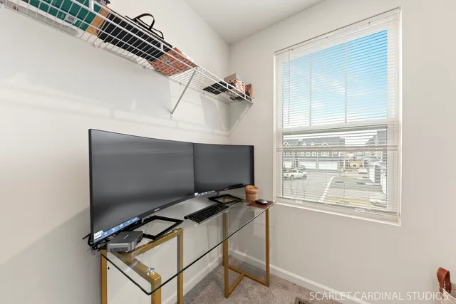 a living room with a flat screen tv and a window