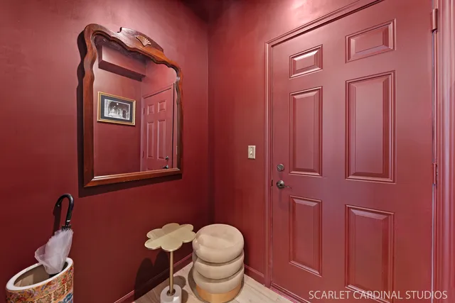 a bathroom with a toilet mirror and vanity
