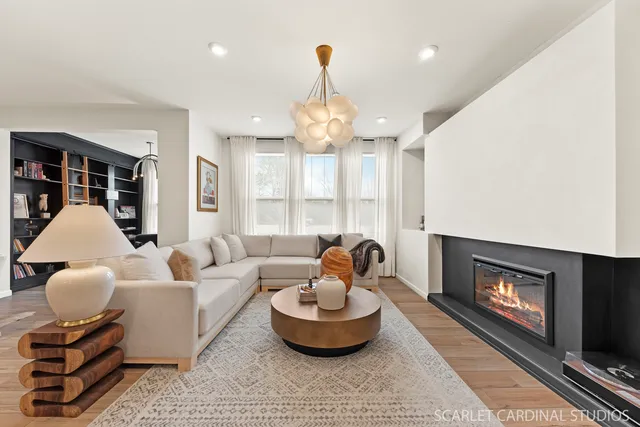 a living room with furniture and a fireplace