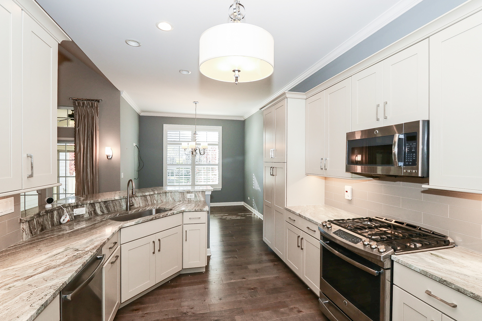 6 Sugar Maple Court Lake In The Hills, IL 60156 - Photo 11 of 35 a large kitchen with stainless steel appliances granite countertop a stove and a sink