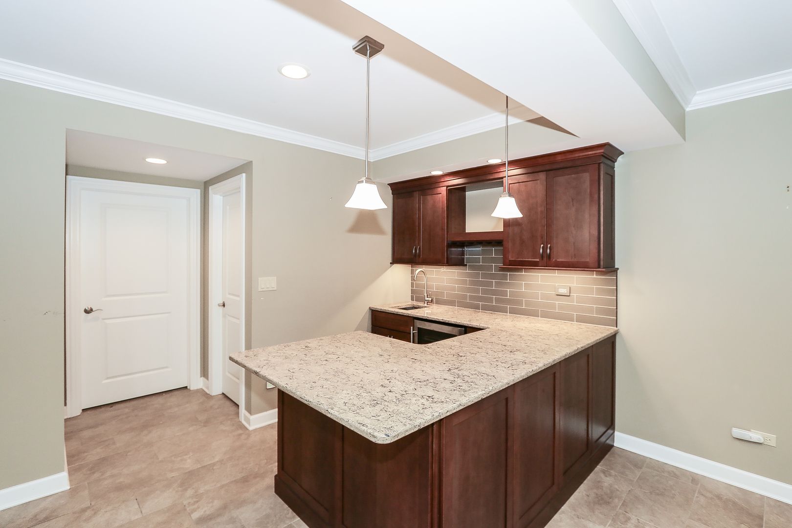 6 Sugar Maple Court Lake In The Hills, IL 60156 - Photo 28 of 35 a kitchen with a sink a counter space and stainless steel appliances