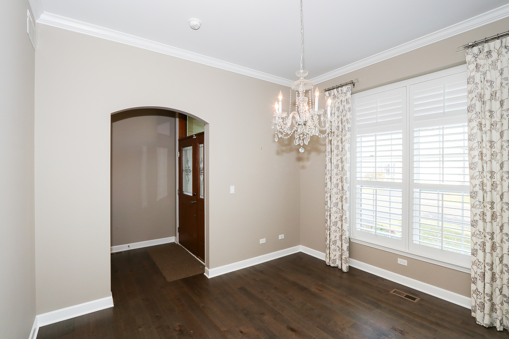 6 Sugar Maple Court Lake In The Hills, IL 60156 - Photo 9 of 35 a view of an empty room with wooden floor and a window