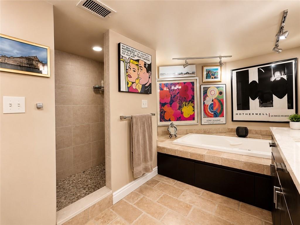 1 Trimont Lane, Unit 490E Pittsburgh, PA 15211 - Photo 18 of 31 The Master Bath is all new with a walk-in ceramic tile shower and a soaking tub. (The Art can stay)