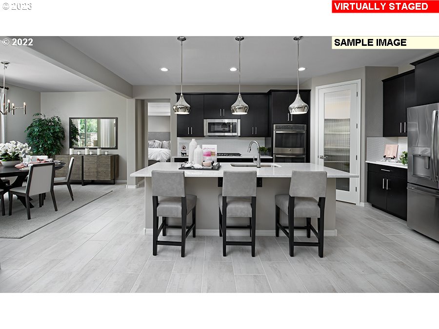 17020 Northeast 27th Court Ridgefield, WA 98642 - Photo 2 of 9 a kitchen with a table and chairs