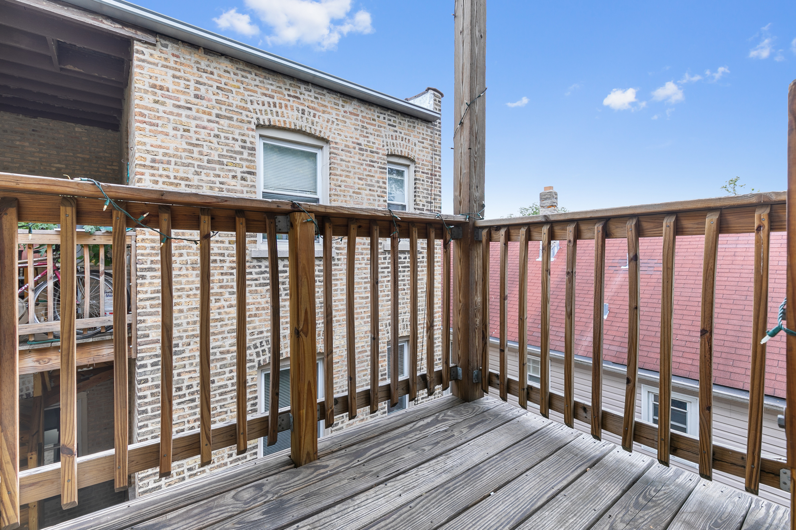 2007 West Jarvis Avenue, Unit 3 Chicago, IL 60645 - Photo 11 of 18 a view of wooden balcony