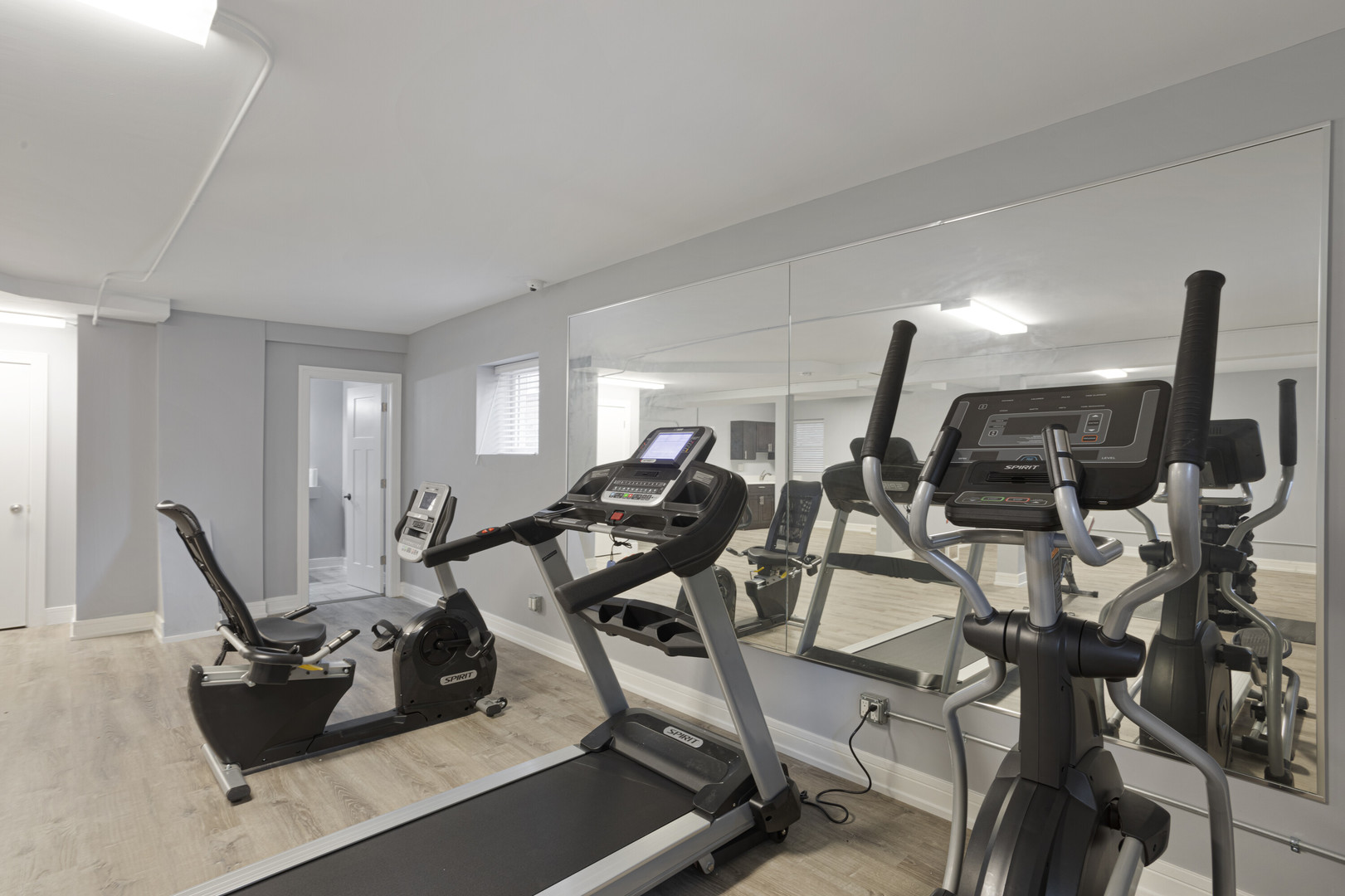 2007 West Jarvis Avenue, Unit 3 Chicago, IL 60645 - Photo 17 of 18 a room with gym equipment and window