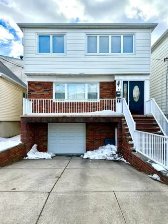 a front view of a house with a garage