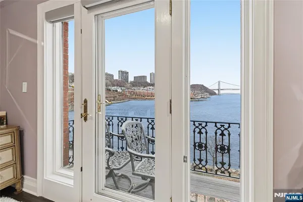 a view of a balcony with wooden floor