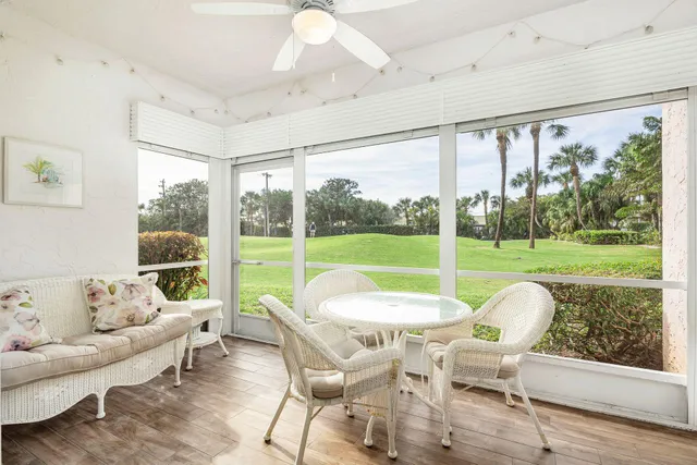 a view of a big room with furniture and garden view