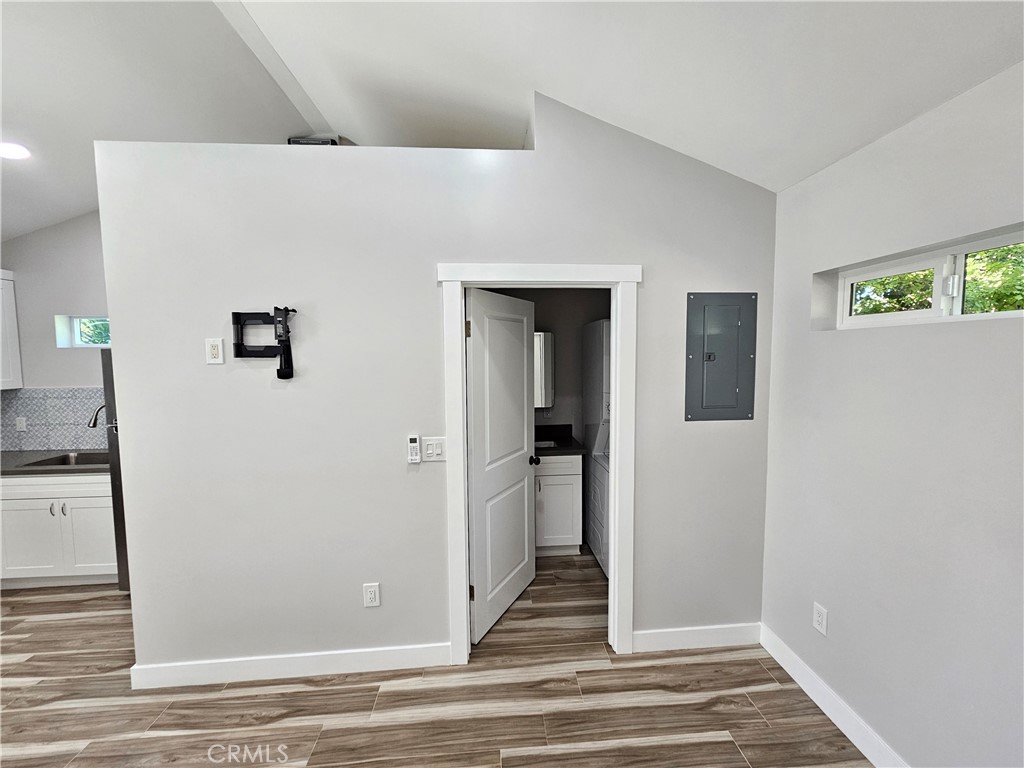 6570 Mt Diablo Avenue Riverside, CA 92506 - Photo 10 of 15 a view of a hallway with wooden floor and staircase