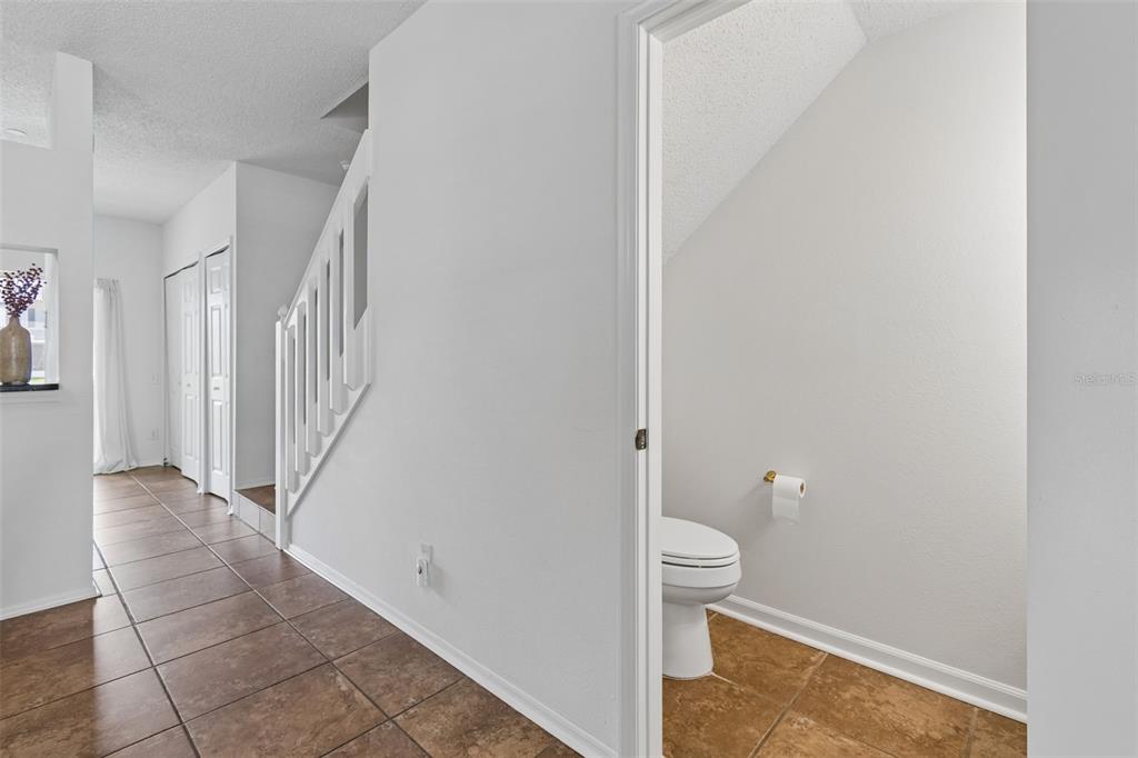 382 Countryside Key Boulevard Oldsmar, FL 34677 - Photo 23 of 58 a bathroom with a granite countertop sink and toilet
