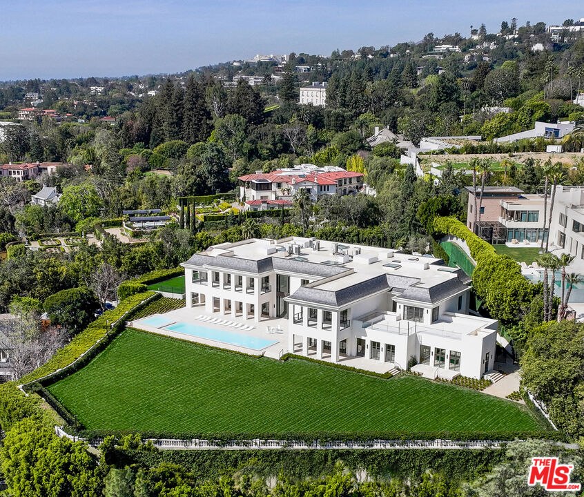 an aerial view of a house with a garden
