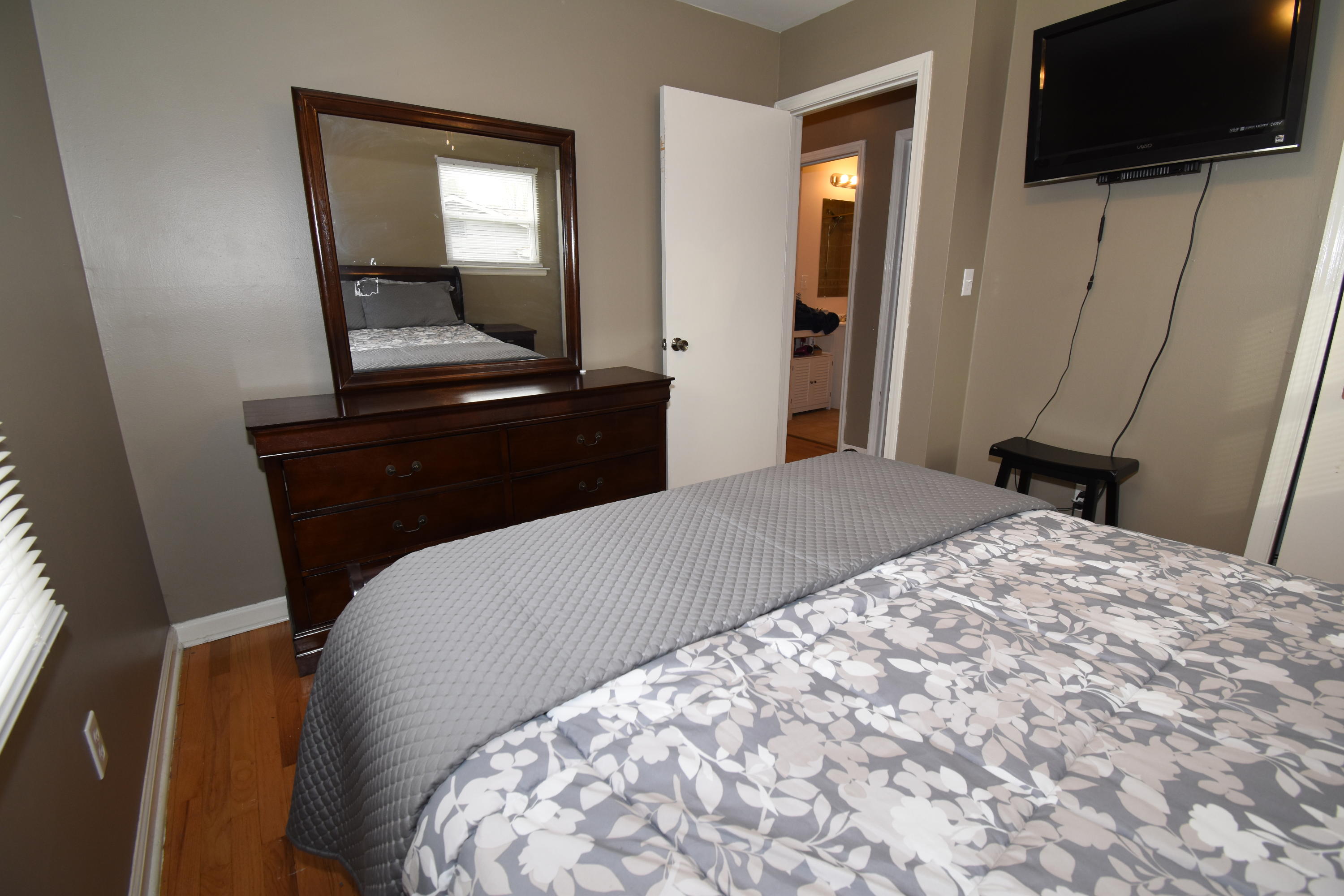 635 Ramada Road Vinton, VA 24179 - Photo 17 of 38 a bedroom with a bed and a flat screen tv