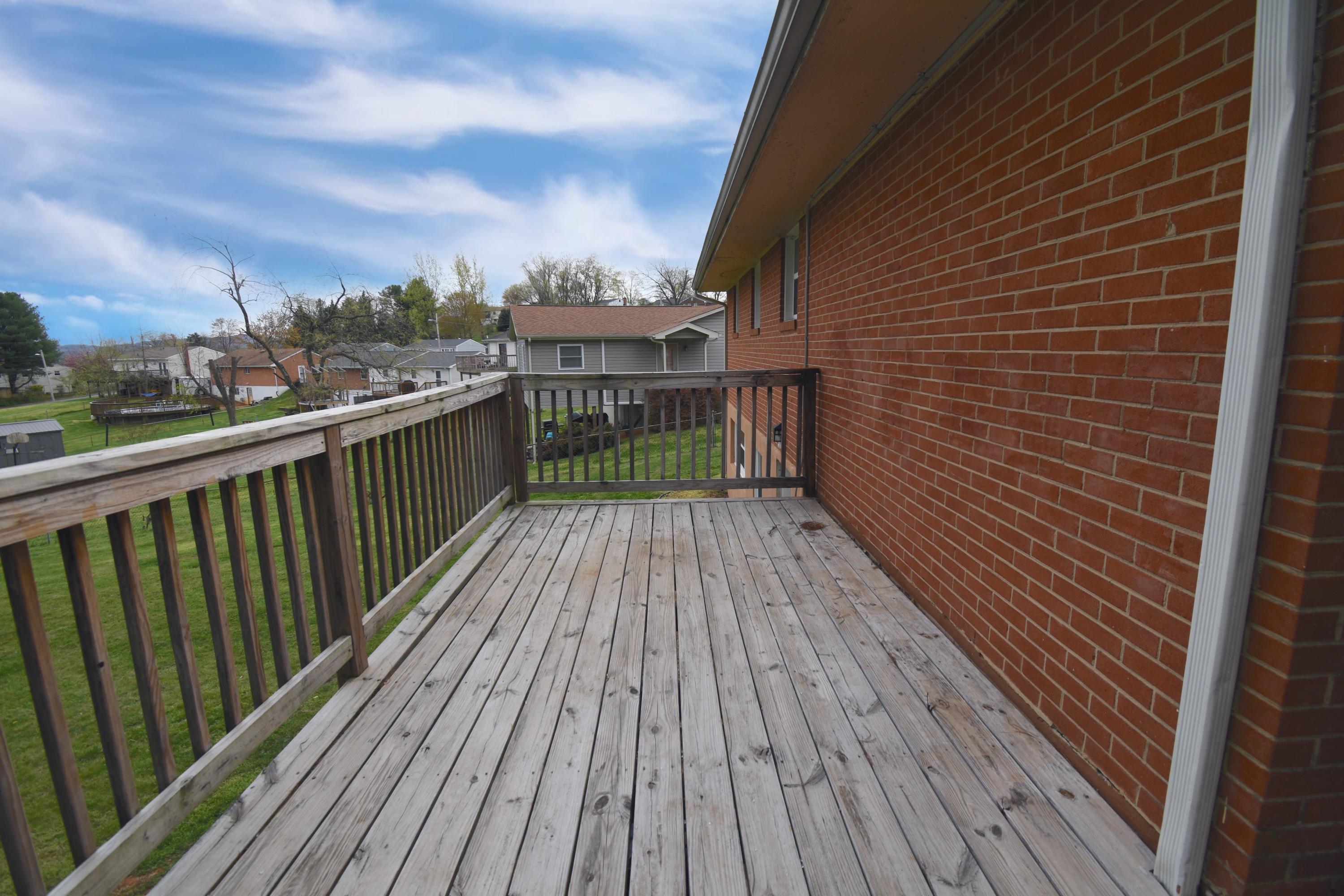 635 Ramada Road Vinton, VA 24179 - Photo 33 of 38 a balcony with wooden floor and city view