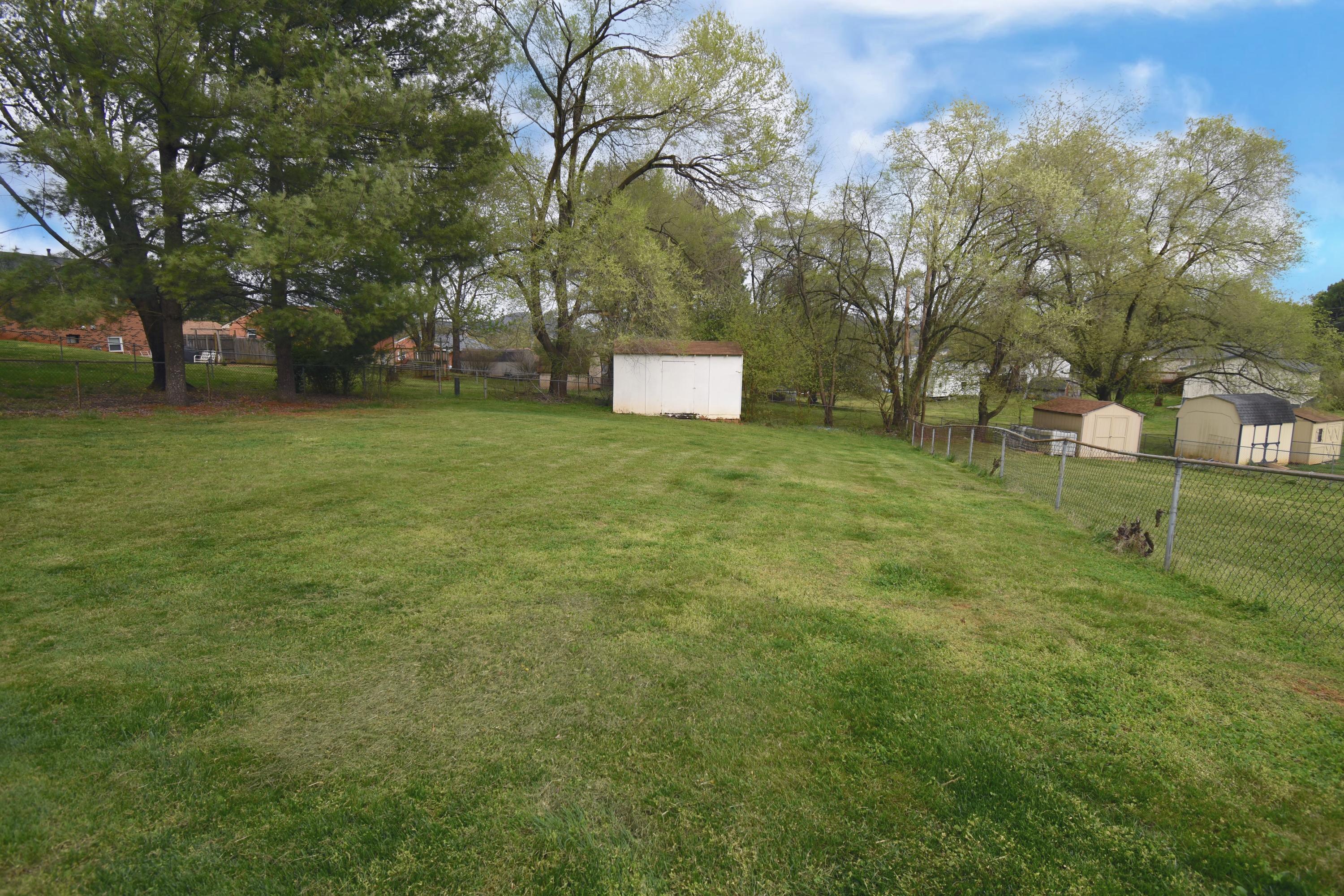 635 Ramada Road Vinton, VA 24179 - Photo 36 of 38 a backyard of a house with lots of green space and outdoor seating