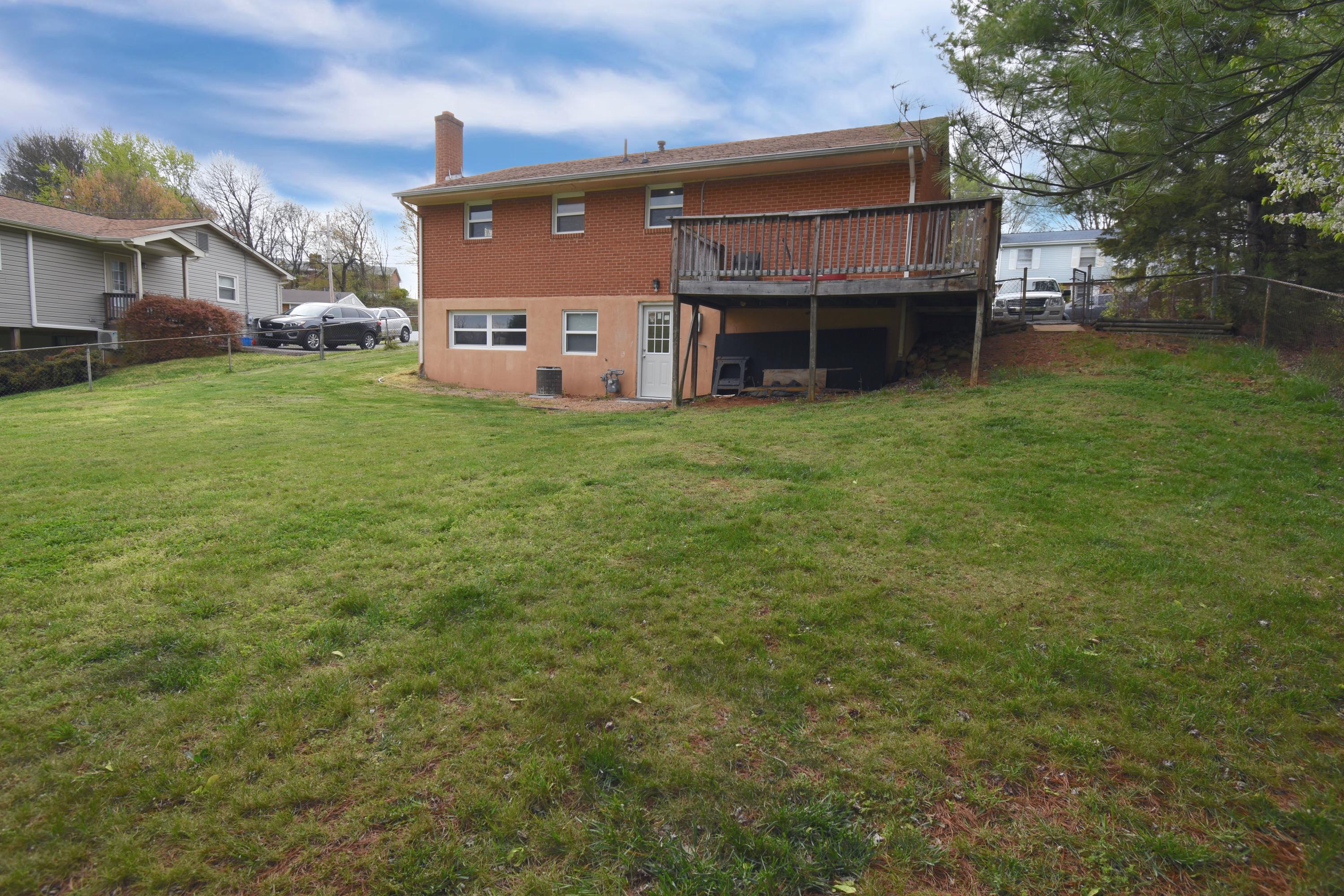 635 Ramada Road Vinton, VA 24179 - Photo 37 of 38 a view of a house with a backyard and a tree