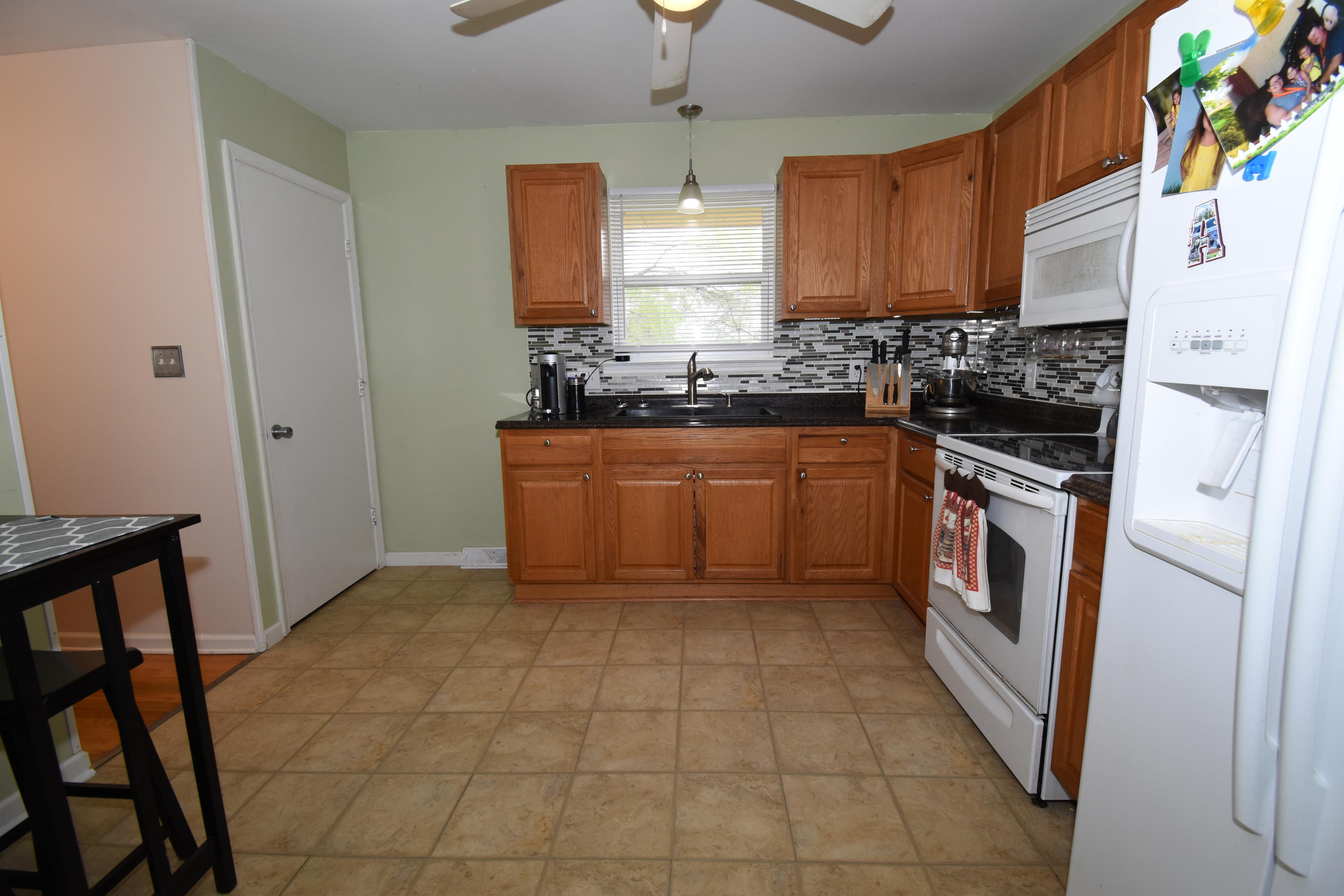 635 Ramada Road Vinton, VA 24179 - Photo 9 of 38 a kitchen with stainless steel appliances granite countertop a stove a sink and a refrigerator