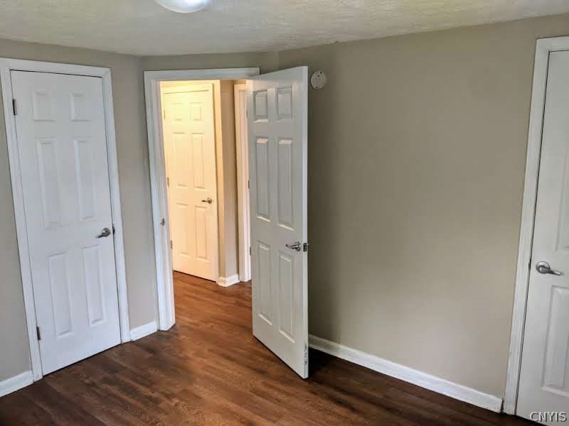 1004 Buckley Road Salina, NY 13088 - Photo 19 of 45 Ample size back bedroom on first floor has two clo