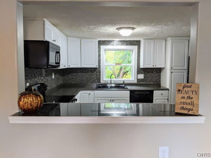 1004 Buckley Road Salina, NY 13088 - Photo 5 of 45 Kitchen opens up to the living area and this break