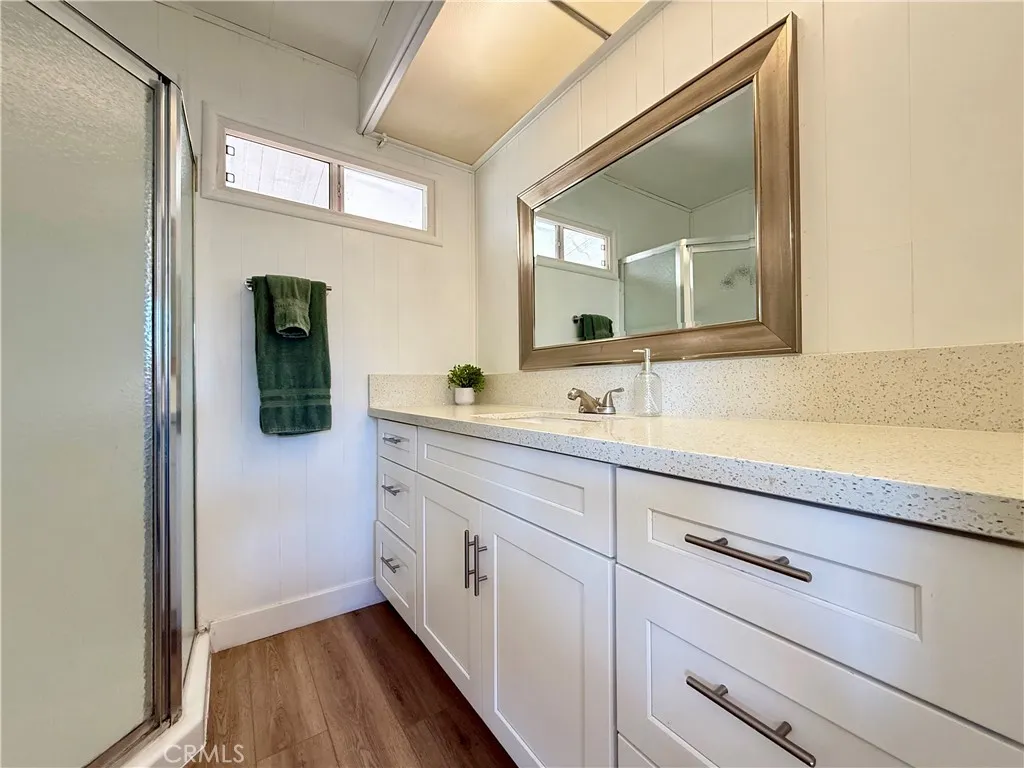 716 North Grand, Unit F8 Covina, CA 91724 - Photo 14 of 21 a spacious bathroom with a double vanity sink and mirror