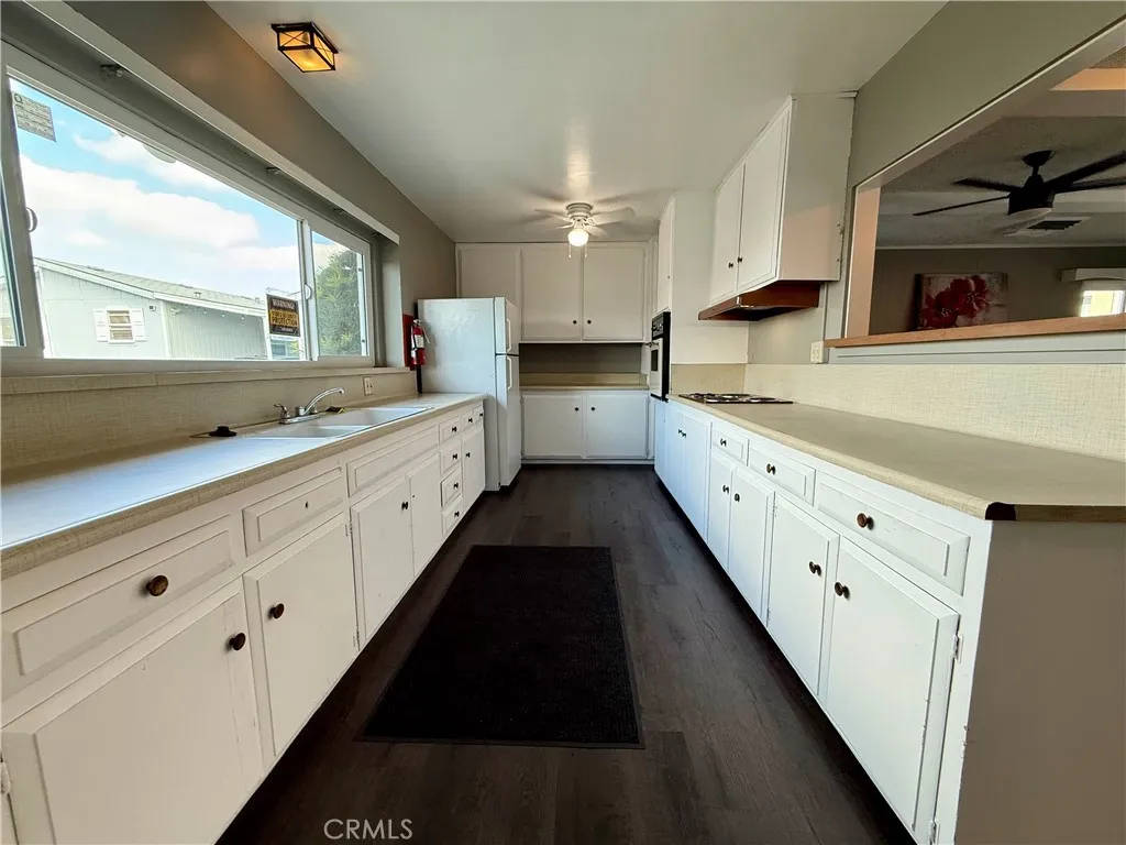 716 North Grand, Unit F8 Covina, CA 91724 - Photo 19 of 21 a large white kitchen with a large window