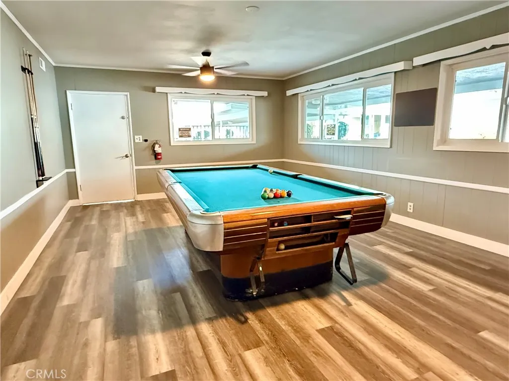 716 North Grand, Unit F8 Covina, CA 91724 - Photo 20 of 21 a room with wooden floor pool table and windows