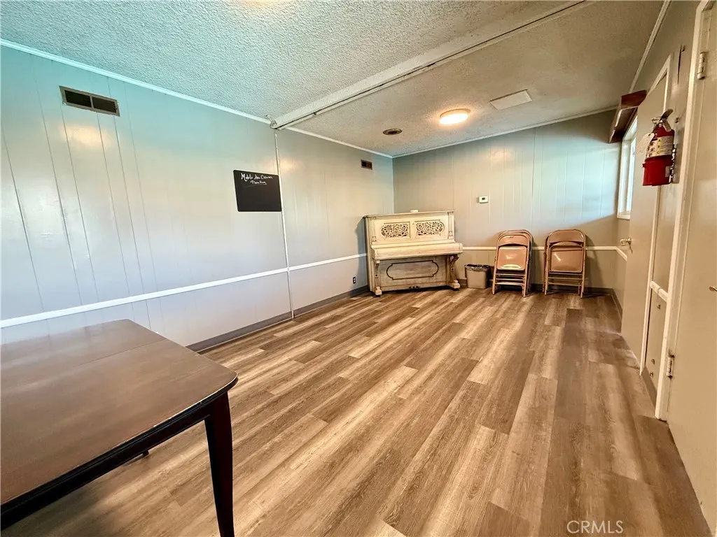 716 North Grand, Unit F8 Covina, CA 91724 - Photo 21 of 21 a spacious bedroom with a bed and a table