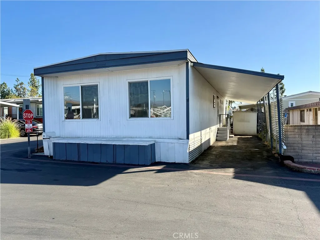 716 North Grand, Unit F8 Covina, CA 91724 - Photo 4 of 21 a front view of a house with a yard